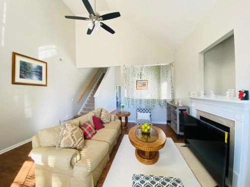 a living room with a couch and a fireplace at Spacious room with Shared bathroom in Raleigh