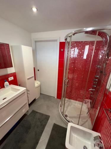 a bathroom with a shower and a sink at Sunset Holiday home in Custonaci
