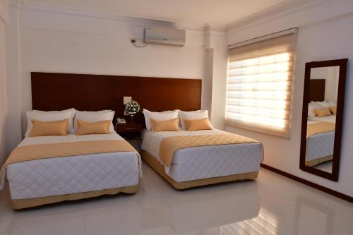 Una cama o camas en una habitación de Prince Hotel