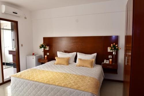 Una cama o camas en una habitación de Prince Hotel