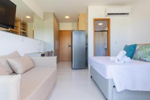 Ένα ή περισσότερα κρεβάτια σε δωμάτιο στο Makia Beach Encantador A-219 - Em Muro Alto