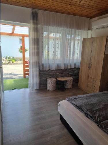 Posteľ alebo postele v izbe v ubytovaní Napfény Apartman