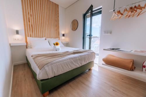 Postel nebo postele na pokoji v ubytování Azores Smart Studios