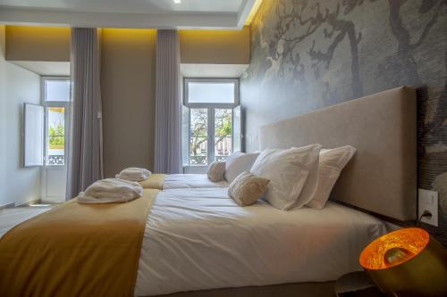 Letto o letti in una camera di Guest House Jacarandá Faro