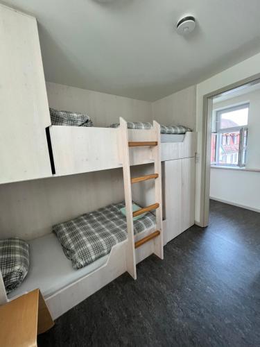 Ein Bett oder Betten in einem Zimmer der Unterkunft Radlerherberge Mainbernheim