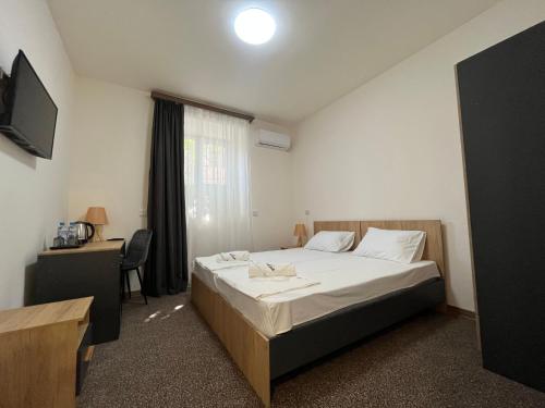 Ένα ή περισσότερα κρεβάτια σε δωμάτιο στο Downtown Budget Hotel by Arami