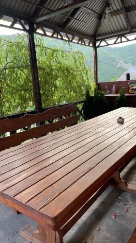 a wooden bench sitting on top of a table at Green Garden in Ijevan