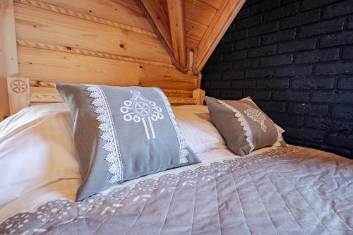 Una cama o camas en una habitación de Zakątek Pod Lasem