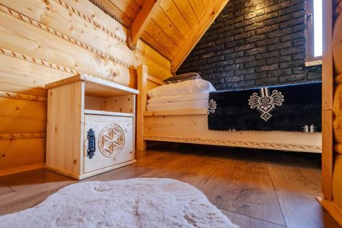 Una cama o camas en una habitación de Zakątek Pod Lasem