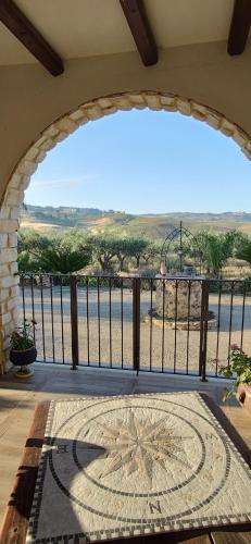 a balcony with a view of the ocean from a resort at B&B Della Via Francigena in Agrigento