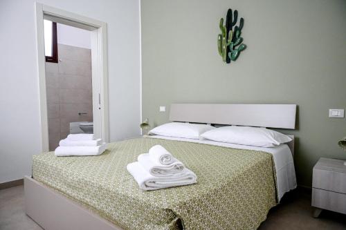 Postel nebo postele na pokoji v ubytování Sykelià - Guest House