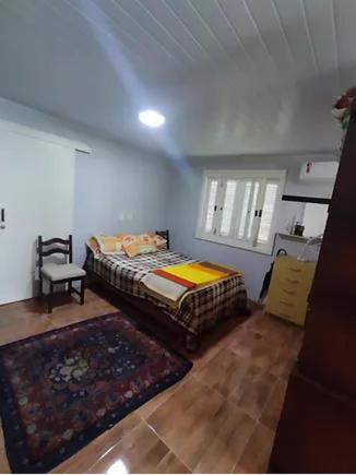 Ένα ή περισσότερα κρεβάτια σε δωμάτιο στο Residencial Vale do Quilombo