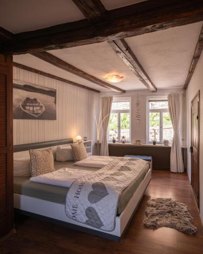 a bedroom with a large bed in a room at Ferienhaus Castle View Quedlinburg in Quedlinburg