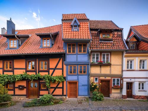 a row of houses with orange roofs at Ferienhaus Castle View Quedlinburg in Quedlinburg