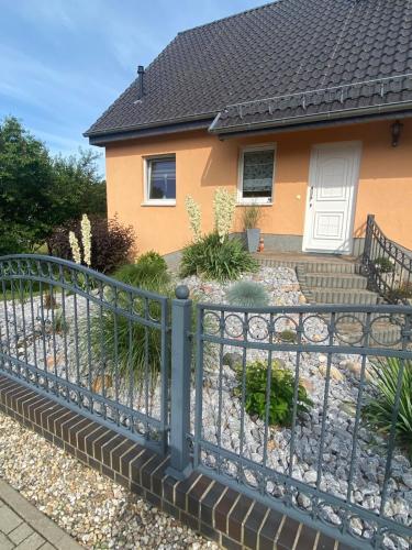 a fence in front of a house at Oase der Ruhe 2 in Waldsieversdorf