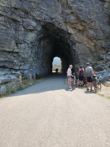 a group of people standing in front of a tunnel at Comfy KING Bed, Large private Basement Suite, Smart TV in Penticton- city of PEACHES AND BEACHES in Penticton