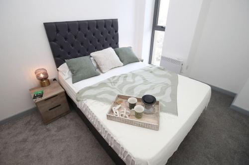 Ένα ή περισσότερα κρεβάτια σε δωμάτιο στο High Point 2 Bed Apartment