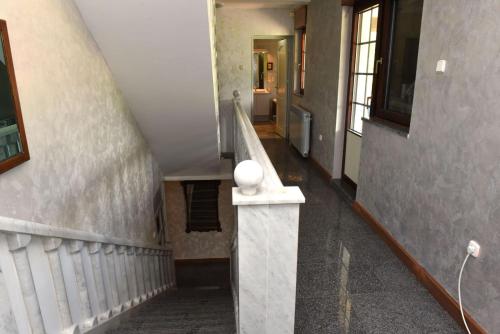 a staircase in a house with a stair case at Villa Tara in Feratovo Polje