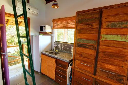 A cozinha ou cozinha compacta de Pousada Arágua