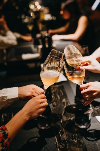 a group of people holding up glasses of champagne at Hotel Granada, a Design Hotel in Atlanta