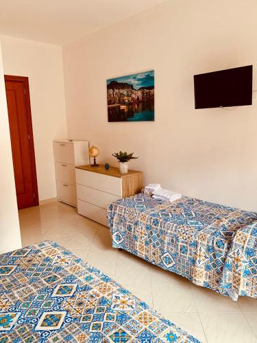 Postel nebo postele na pokoji v ubytování Campofelice Happy Casa