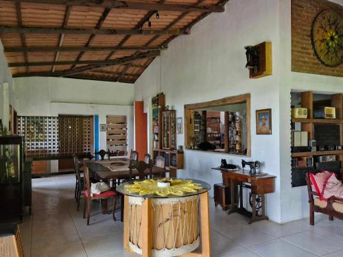 a room with a table and chairs and a dining room at Solar de Bonito in Bonito