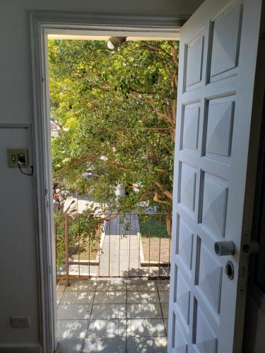a door leading into a yard with a gate at Pousada Monte Gerizim in Sao Paulo