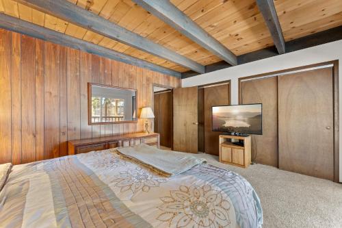 a bedroom with a bed and a television in it at Corwin's Quarters in Kings Beach