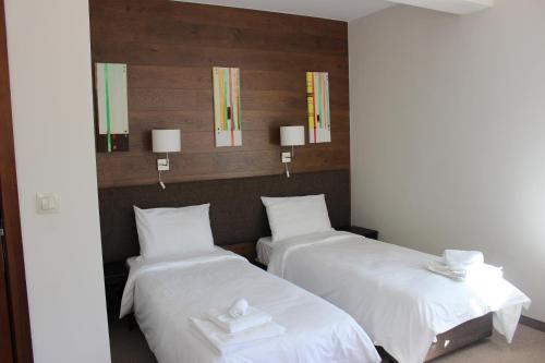 Cama o camas de una habitación en Trigrad Hotel