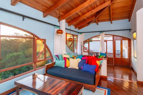 a living room with a couch and a table at Finca Rosa Blanca Coffee Farm and Inn in Heredia