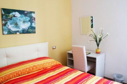 A bed or beds in a room at Il Giardinetto Guest House