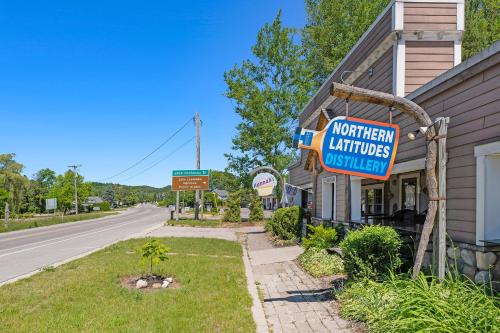 a sign for a northwestern antiquities museum next to a street at The Birches in Lake Leelanau