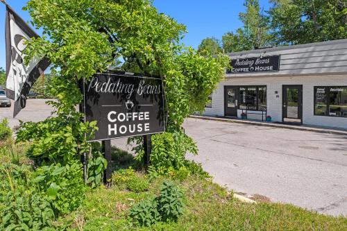 a sign for a coffee house in front of a building at The Birches in Lake Leelanau