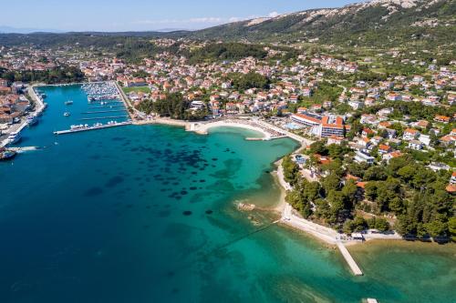 an aerial view of a town on a lake at Apartment Sanja in Rab