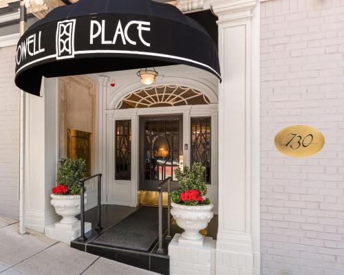 a store front of a building with a sign on it at Powell Place in San Francisco