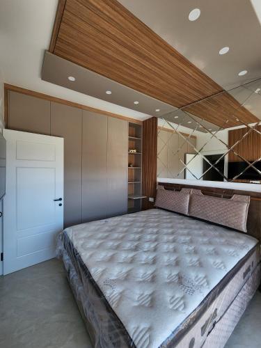 a bedroom with a large bed in a room at Vienna Luxury Apartments in Dobra Voda