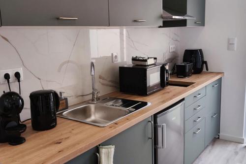 A cozinha ou cozinha compacta de Azure Loft