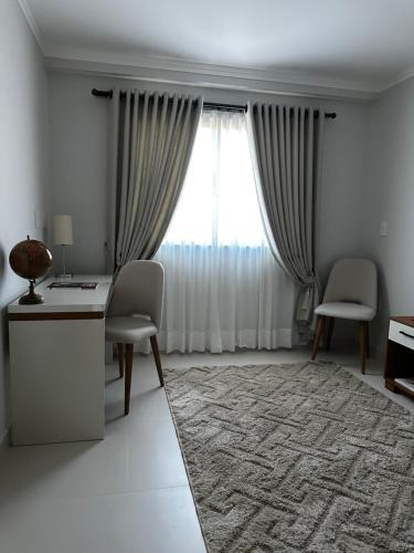 Χώρος καθιστικού στο Venda Nova Apart