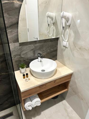 a bathroom with a white sink and a mirror at SUPREME Luxury in Ulcinj
