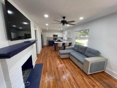 a living room with a couch and a fireplace at Charming Family Retreat in Augusta