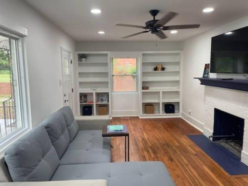 a living room with a couch and a fireplace at Charming Family Retreat in Augusta
