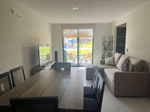 a living room with a couch and a table at Casa Cordova in Alpuyeca