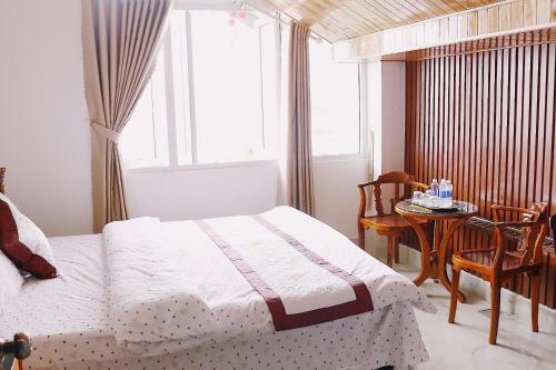 Giường trong phòng chung tại IvySnow Đà Lạt