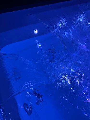 a pool of blue water with rocks in it at Le Cisterne Guest house Suite&Rooms in Vasto