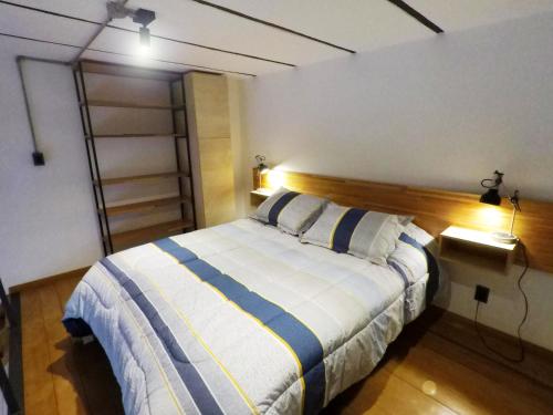Postel nebo postele na pokoji v ubytování LoFt mANoLO