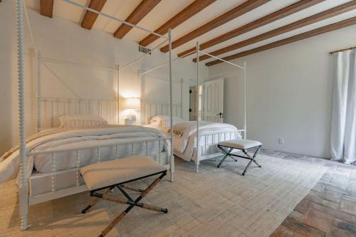 a bedroom with two twin beds and a wooden ceiling at Idyllic Casita on Private Fairbanks Ranch Estate in Rancho Santa Fe