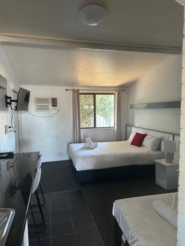 Postel nebo postele na pokoji v ubytování Allan Cunningham Motel