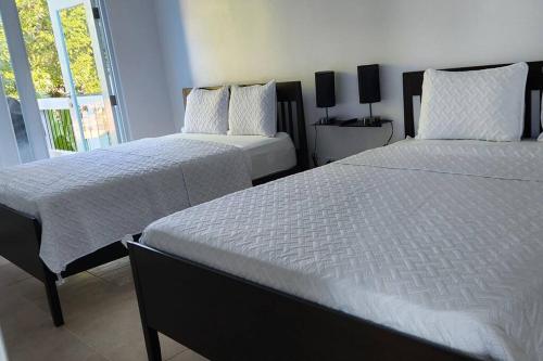 Katil atau katil-katil dalam bilik di Sweet Sunset 6 Playa Rompeolas Aguadilla