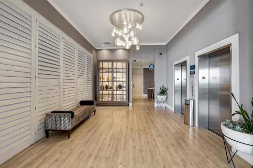 an office lobby with a couch and a chandelier at Ocean View Hotel in Los Angeles
