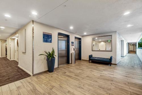 an office lobby with a couch and a hallway at Ocean View Hotel in Los Angeles